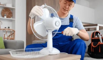 male-technician-repairing-electric-fan-260nw-2760954355
