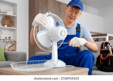 male-technician-repairing-electric-fan-260nw-2760954355