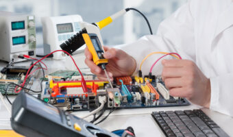 Repairman fixes electronic equipment